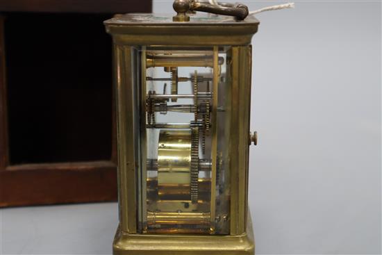 A brass mounted carriage timepiece and case